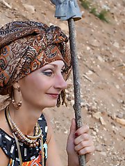 With spear wearing in colorful dress