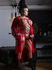 Danish Domina Dark in red fishnet bodysuit