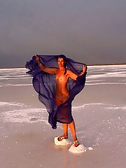 Beautiful sunset scenery by a shawl on a salt lake