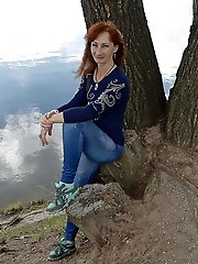 A beautiful mature woman is fondling her genital area